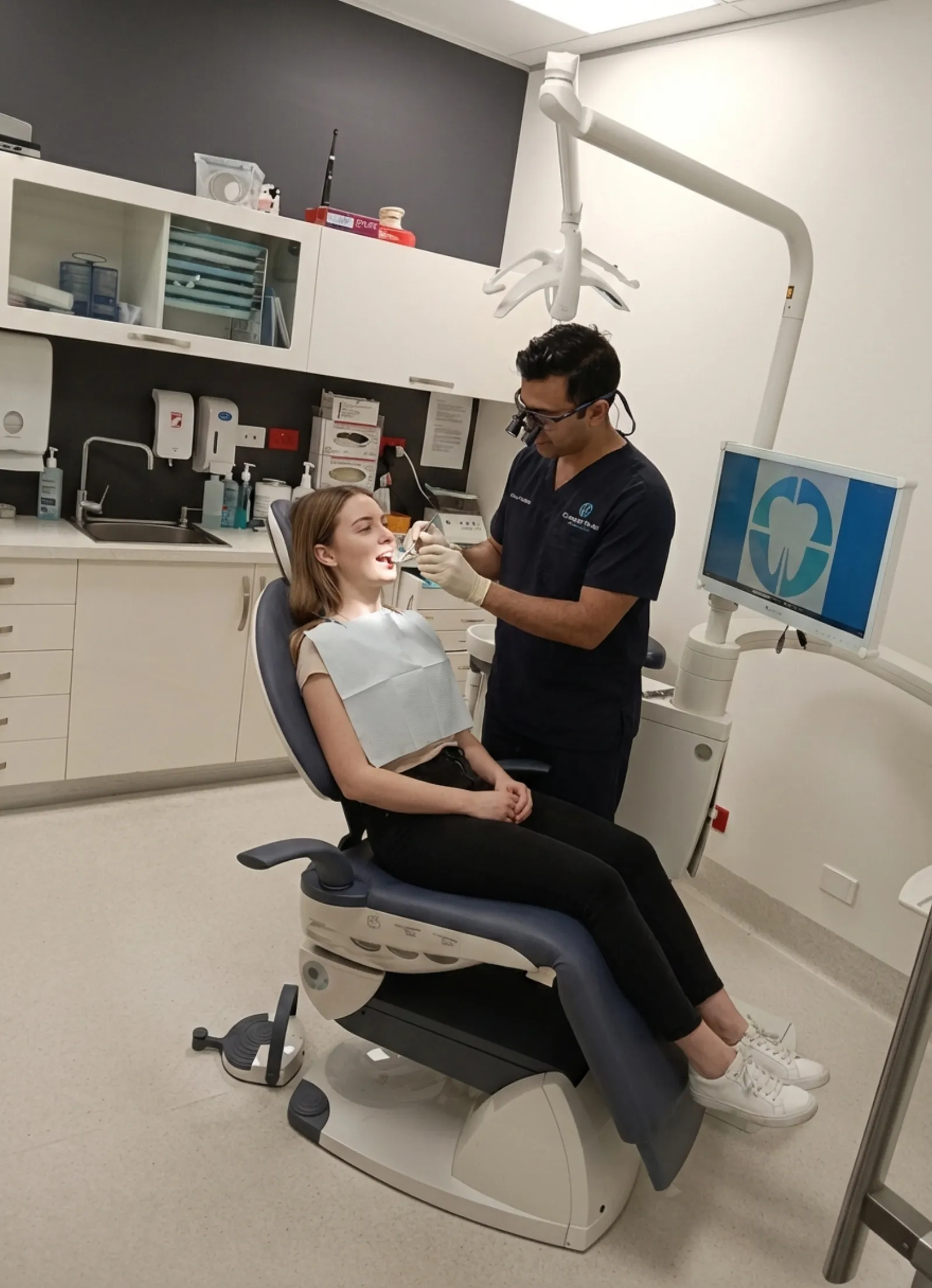 Dentist examining patient for wisdom teeth assessment at Compass Dental Care Darwin